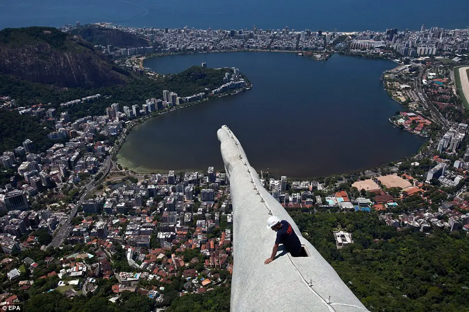 A Construction Worker Carrying Out Repairs on the Arm of Christ The Redeemer