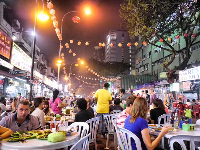 Sitting and Eating Amongst the Crowds on Jalan Alor - Kuala Lumpur, Malaysia