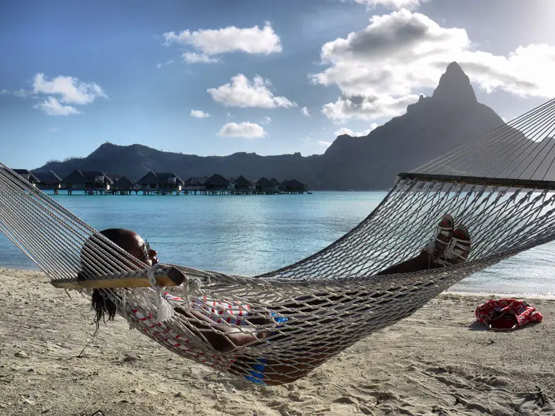 Nat Relaxing in a Hammock on a Private Beach in Bora Bora