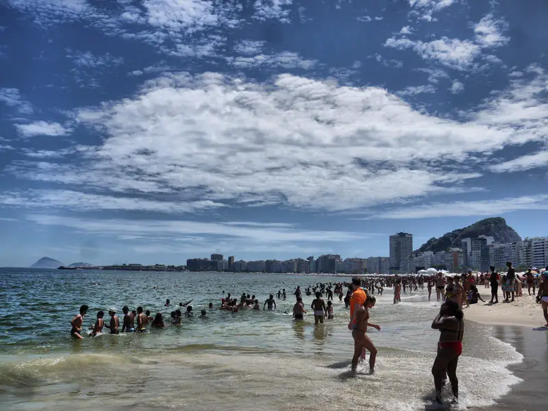 Sunseekers Cooling Down in the Sea on Copacabana Beach
