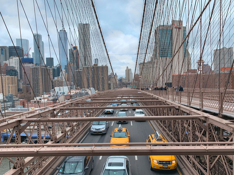 Marvel at the Taxis and Cars, as they Drive Beneath your Feet Along Brooklyn Bridge