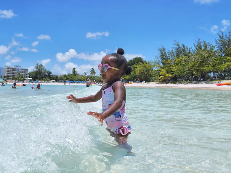 Little Girl Kid on Pebbles Beach Carlisle Bay in Barbados (Family Fun)
