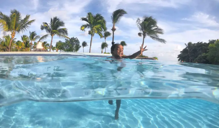 Girl in Swimming Pool at the Hilton Barbados Resort Hotel