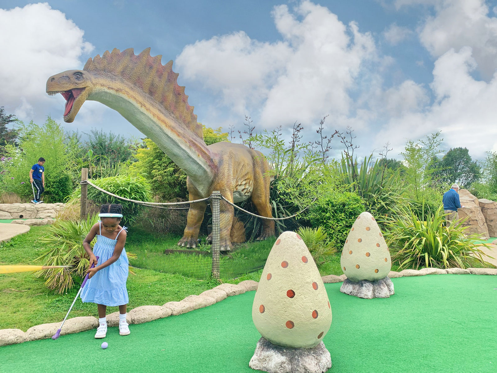 Girl Kid and Dinosaur at Crazy Adventure Golf London