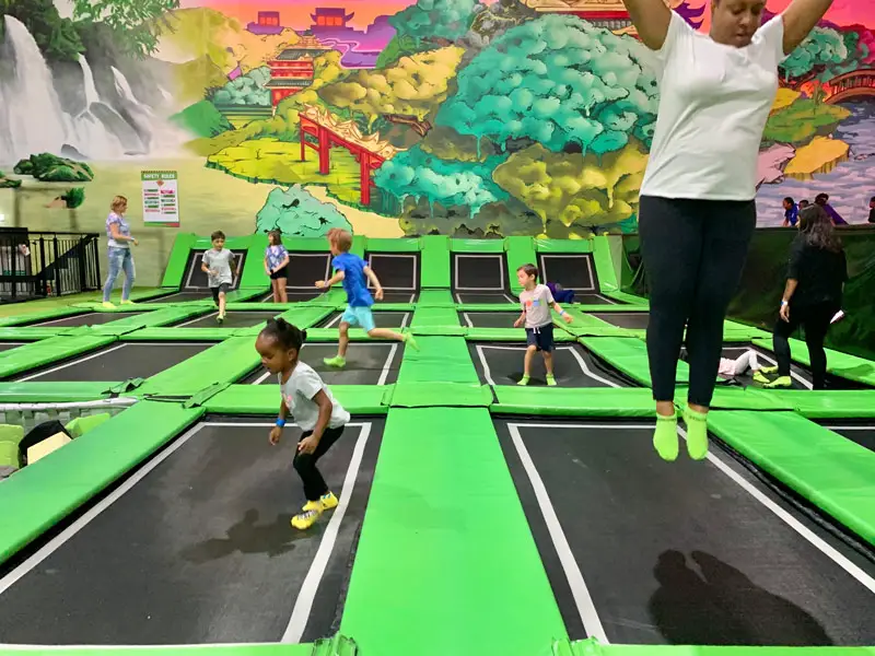 Kids and Adults Jumping on Indoor Trampolines at Flip Out London