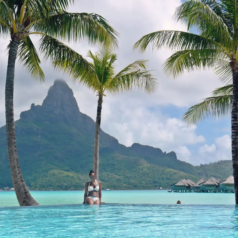 Woman in Infinity Pool at the Intercontinental Bora Bora Thalasso Resort & Spa