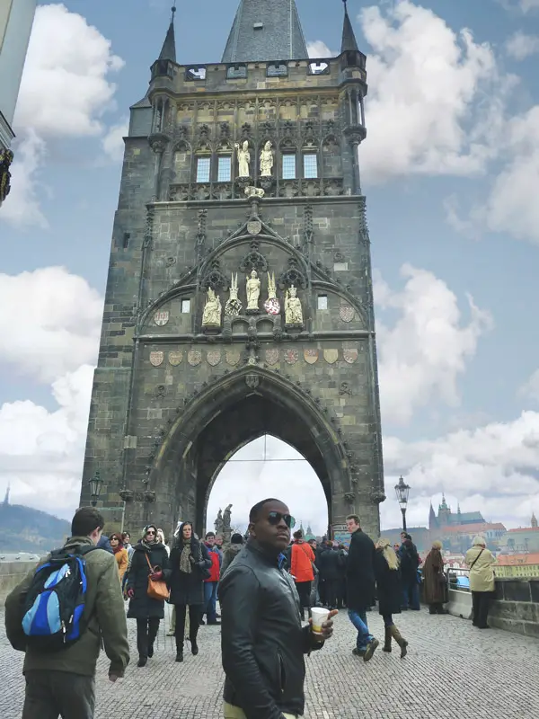 Mase at the Entrance of Charles Bridge in Prague (Best European City Breaks for Couples)