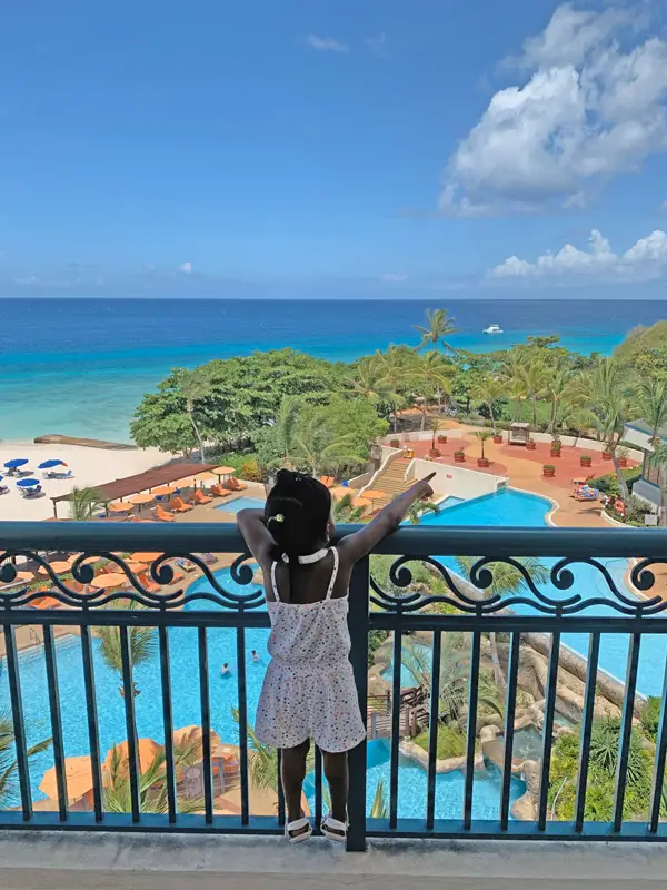 Our Daughter on Our Hotel Room Balcony at the Hilton Barbados Resort