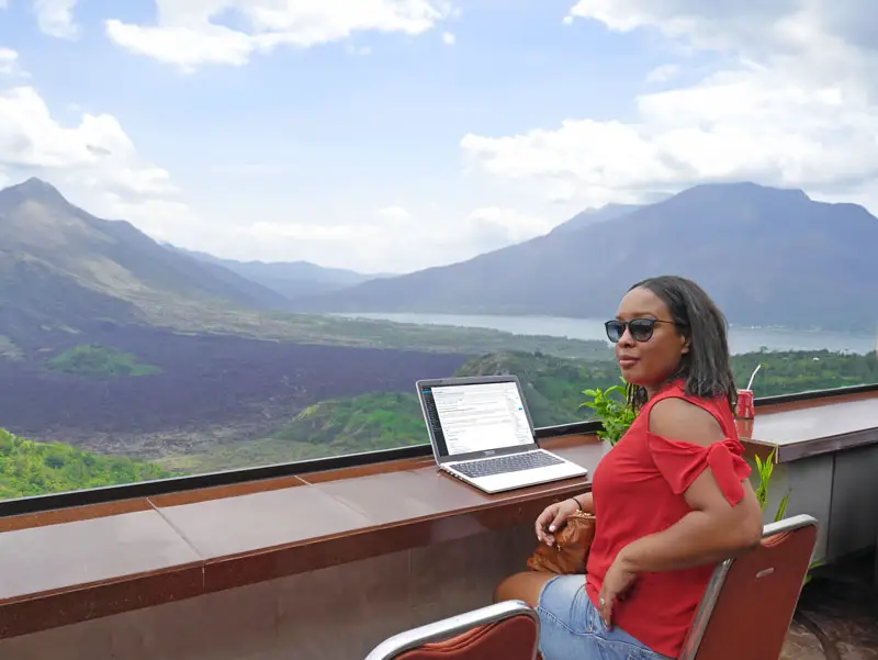 Digital Nomad in Bali Mountains with Laptop on Desk Working